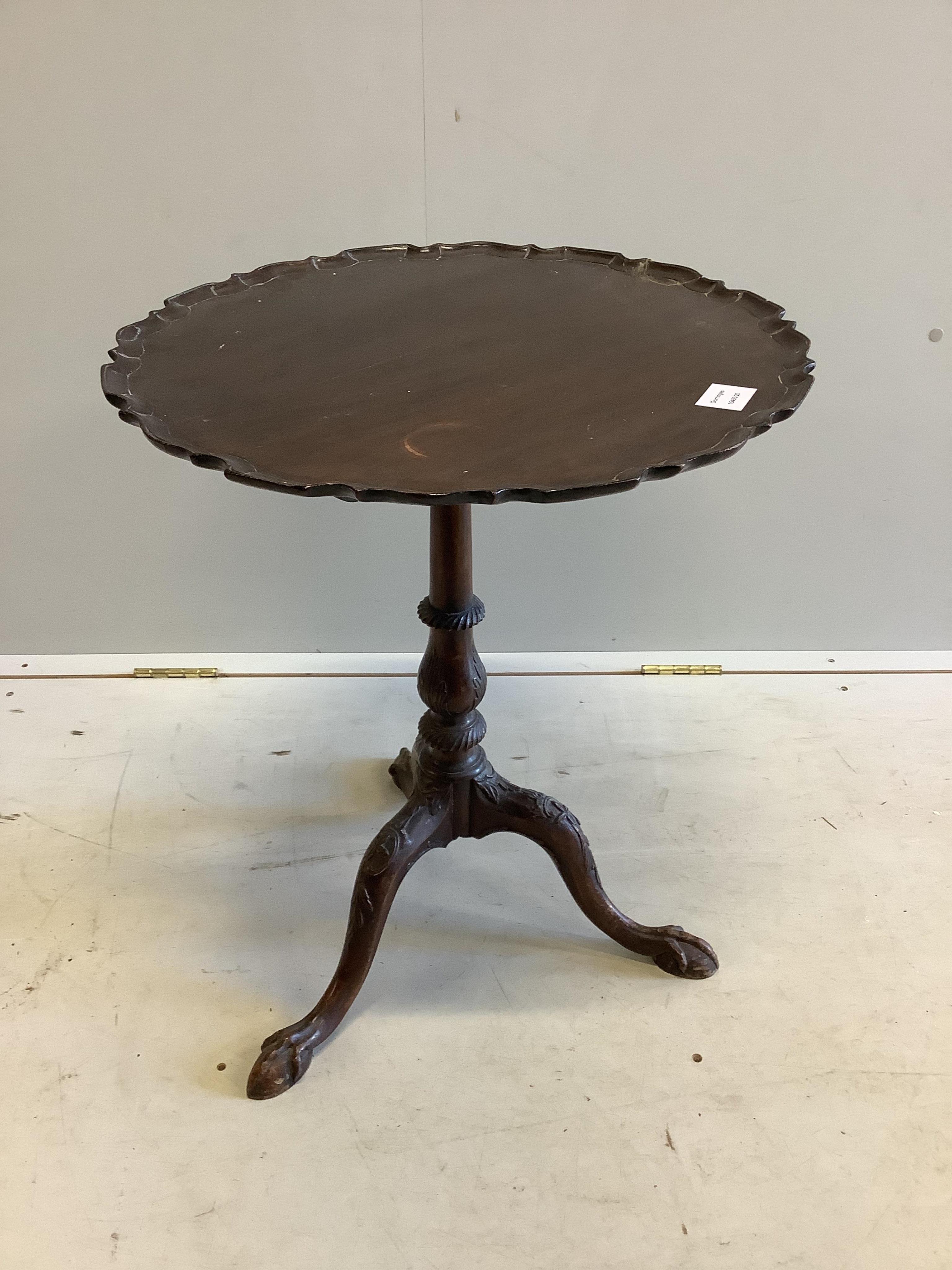 A George III style circular mahogany tripod wine table, diameter 52cm, height 62cm. Condition - fair